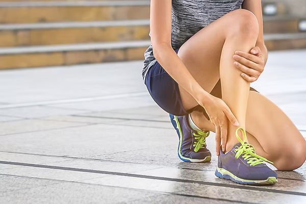 Chiropractor treating hip and knee pain for improved mobility in Lansing MI