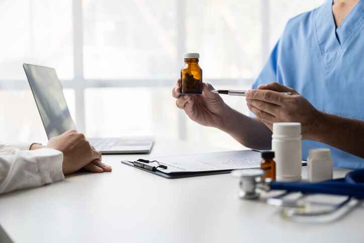 Holistic physician Lansing MI conducting a wellness consultation and whole-person evaluation.