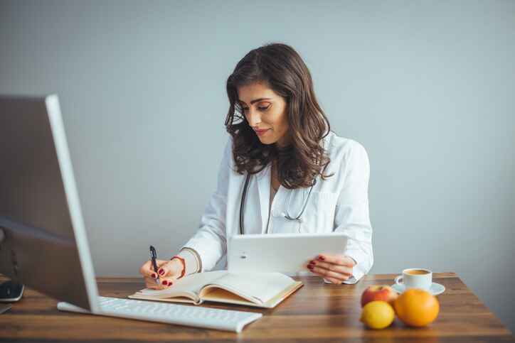 Nutrition specialist reviewing test results as part of comprehensive wellness services in Lansing to support personalized health plans.